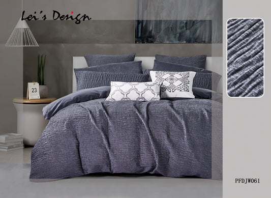 A gray comforter set on a bed, with a close-up of the textured pattern on the comforter, displayed in a room setting with decorative pillows and a nightstand.