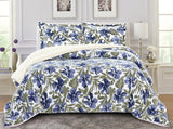 A king-sized floral thermal comforter set with blue, white, and green colors, displayed with two pillow shams.