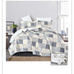 Patchwork quilt set on a bed in a bedroom setting