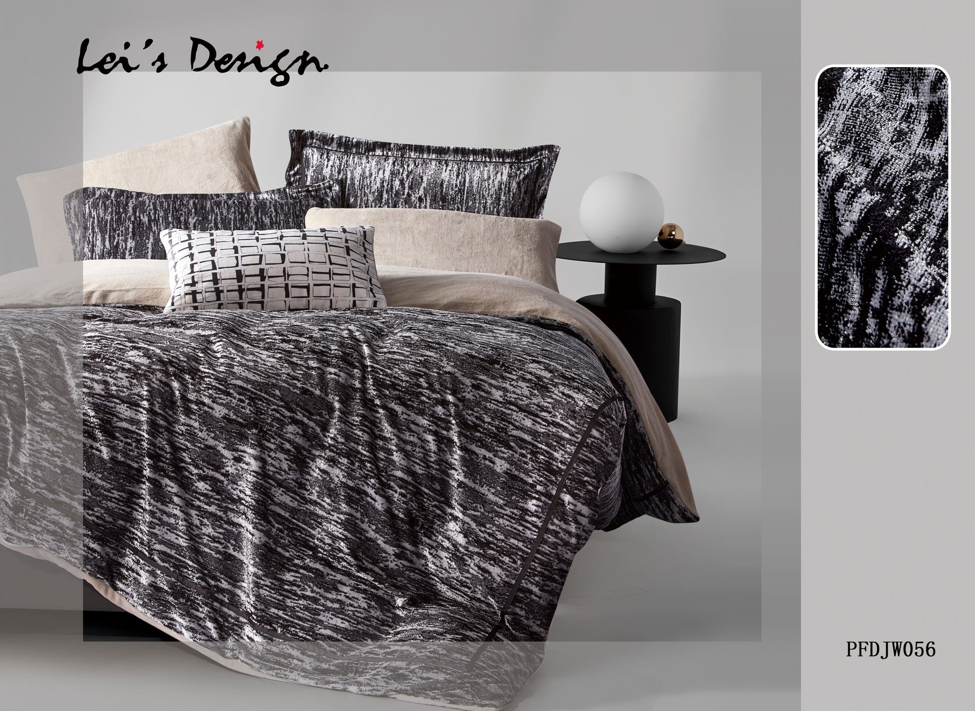 A bedroom scene with a black and white comforter set on the bed, along with matching pillows, bed sheets, and a decorative lamp.