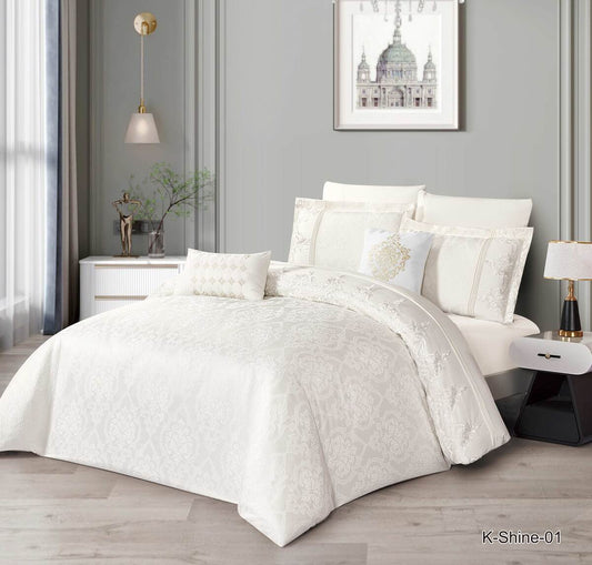 A cream-colored lace bedding set on a bed, with matching pillows and comforter, in a bedroom setting.