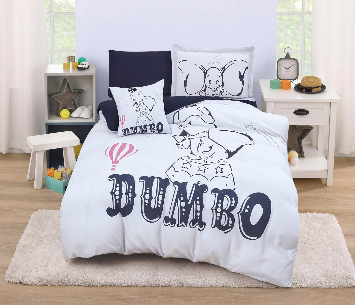 A bedding set with a design featuring the character Dumbo from Disney, with white and black colors predominantly used.