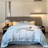 A blue duvet cover with lace trim, displayed on a bed in a bedroom setting.