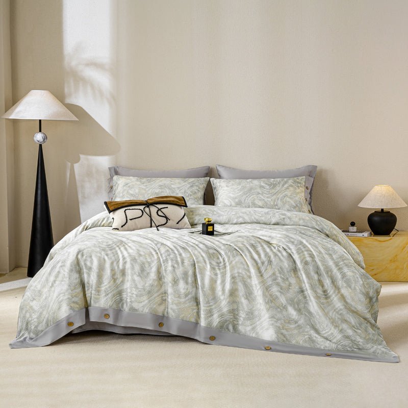 A duvet cover set with a leaf pattern, displayed in a bedroom setting with pillows, bed, and lighting.
